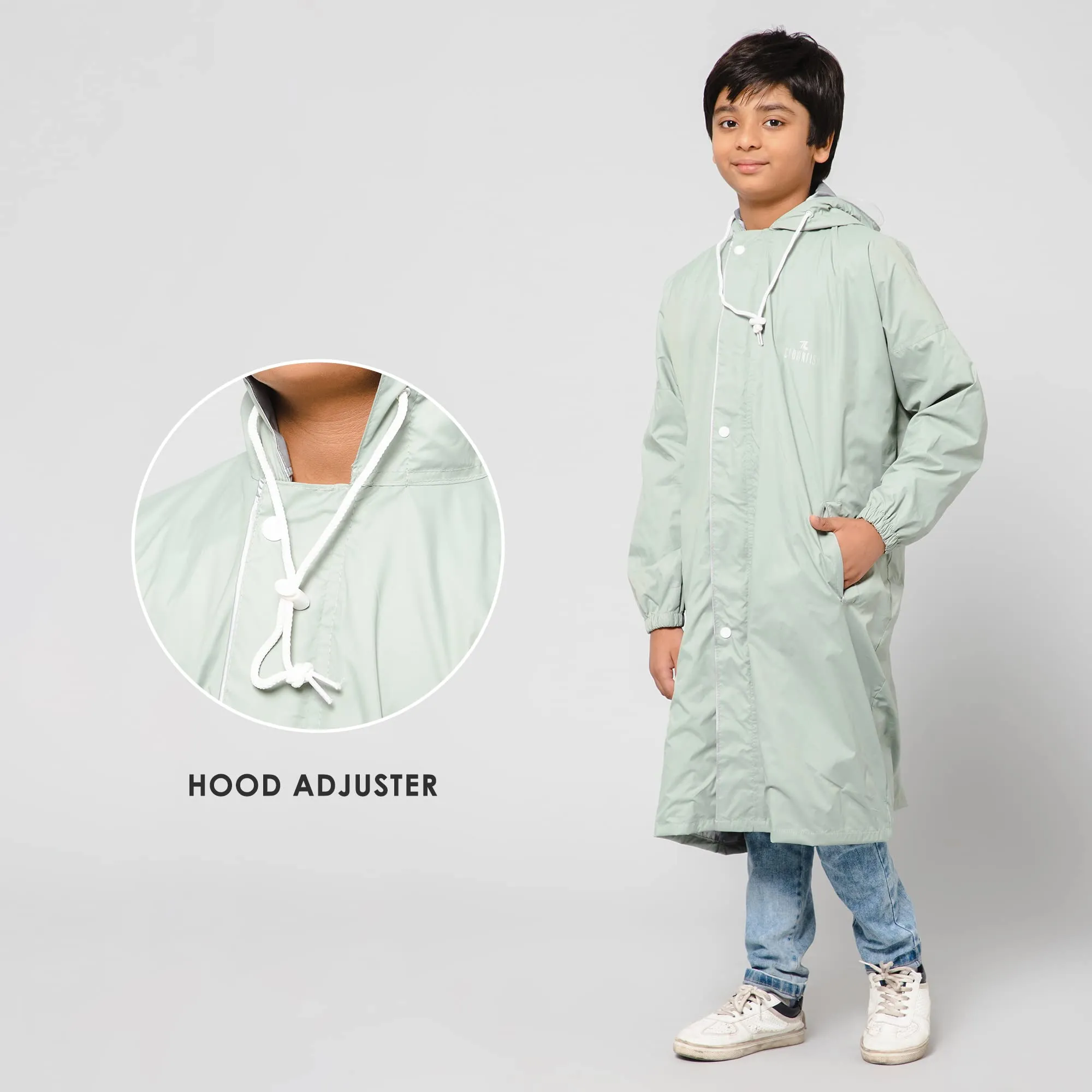 THE CLOWNFISH Cloud Chaser Series Kids Raincoat Waterproof Polyester Double Coating Reversible Longcoat with Hood and Reflector Logo at Back. Printed Plastic Pouch. Kid Age-13-14 years (Pista Green)