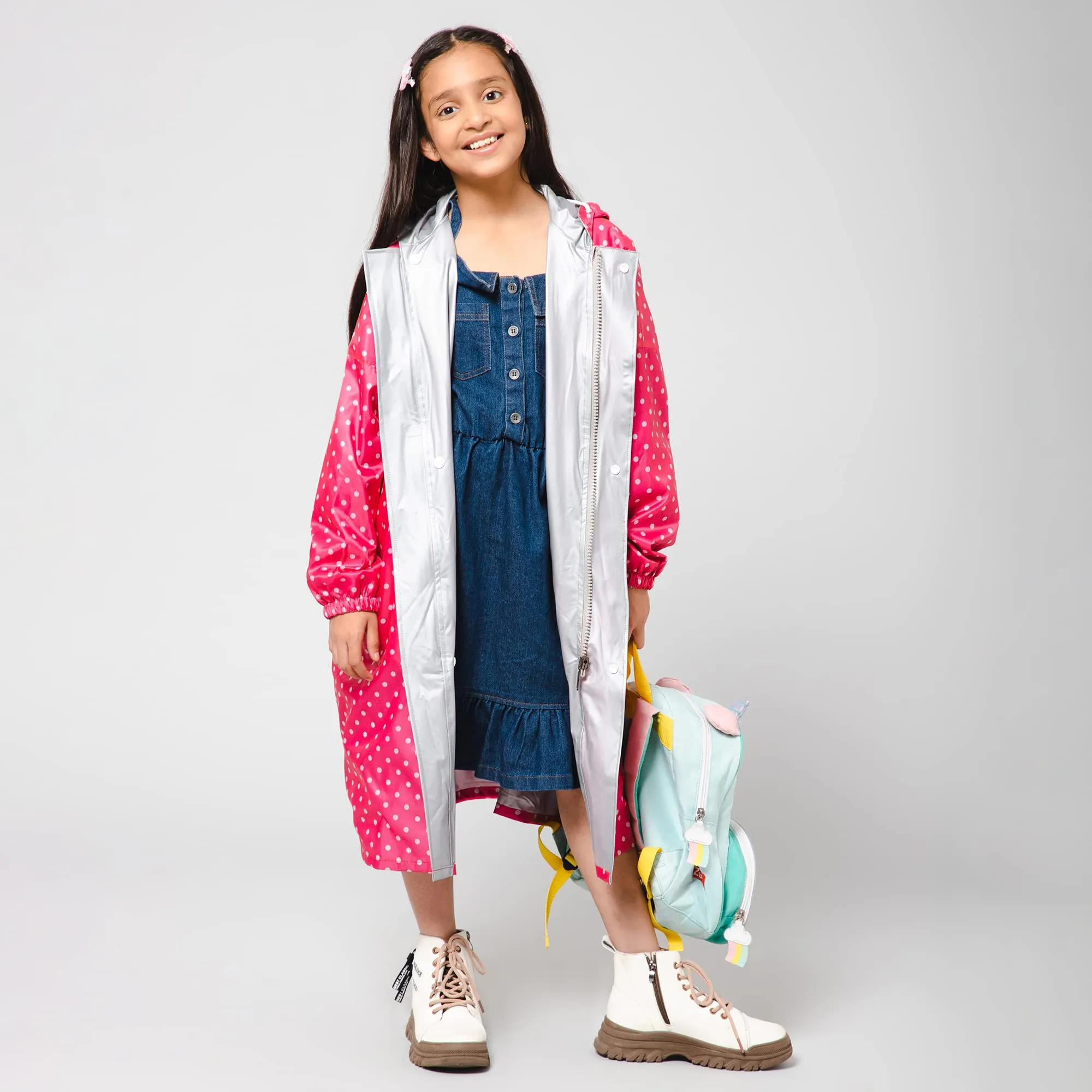 The Clownfish Drizzle Dot Series Kids Raincoat Waterproof Polyester Double Coating Reversible Longcoat with Hood and Reflector Logo at Back. Printed Plastic Pouch. Kid Age-13-14 years (Bubblegum Pink)